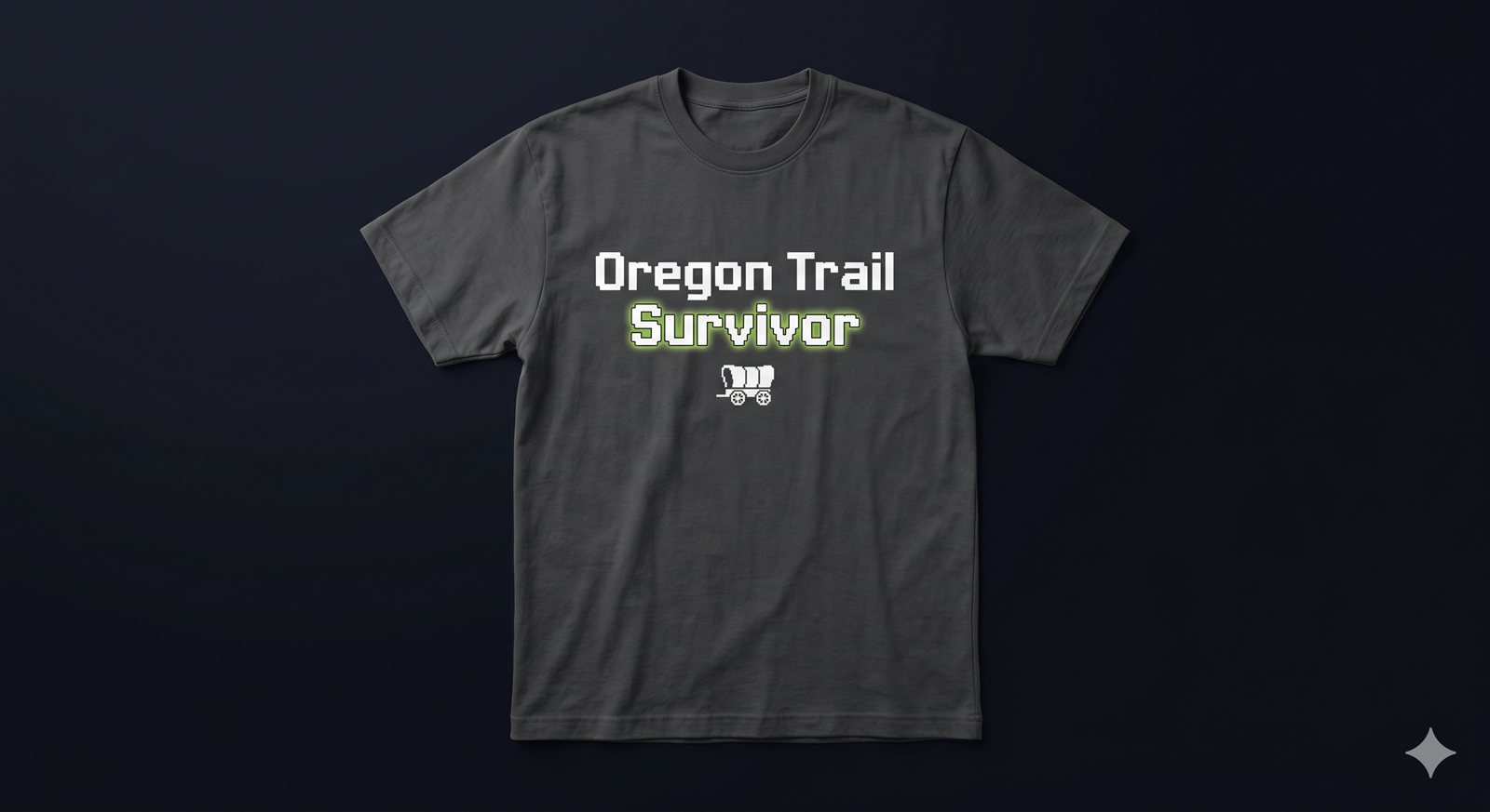 Charcoal tee mockup, pixel font reading: Oregon Trail Survivor, with a small pixel-art covered wagon.